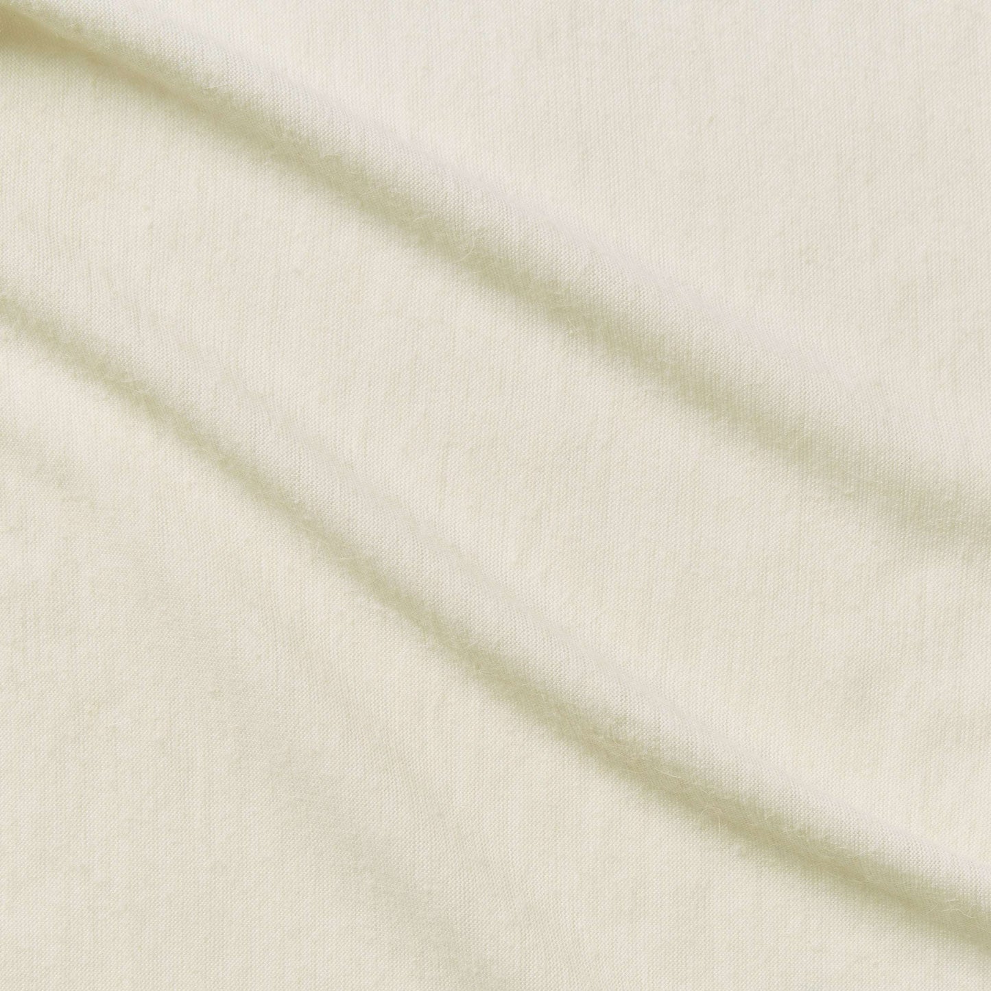 angora showing the ivory color version with stretch knit warm angora hand feel from a acrylic and polyester blend