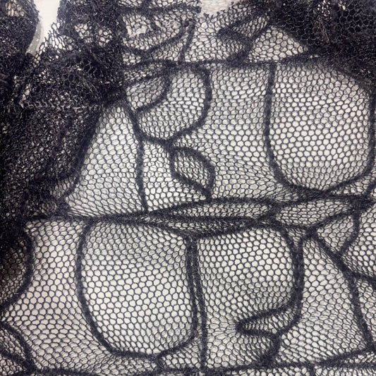 Exhibiting a closeup of the intricate lace pattern of Bedlam