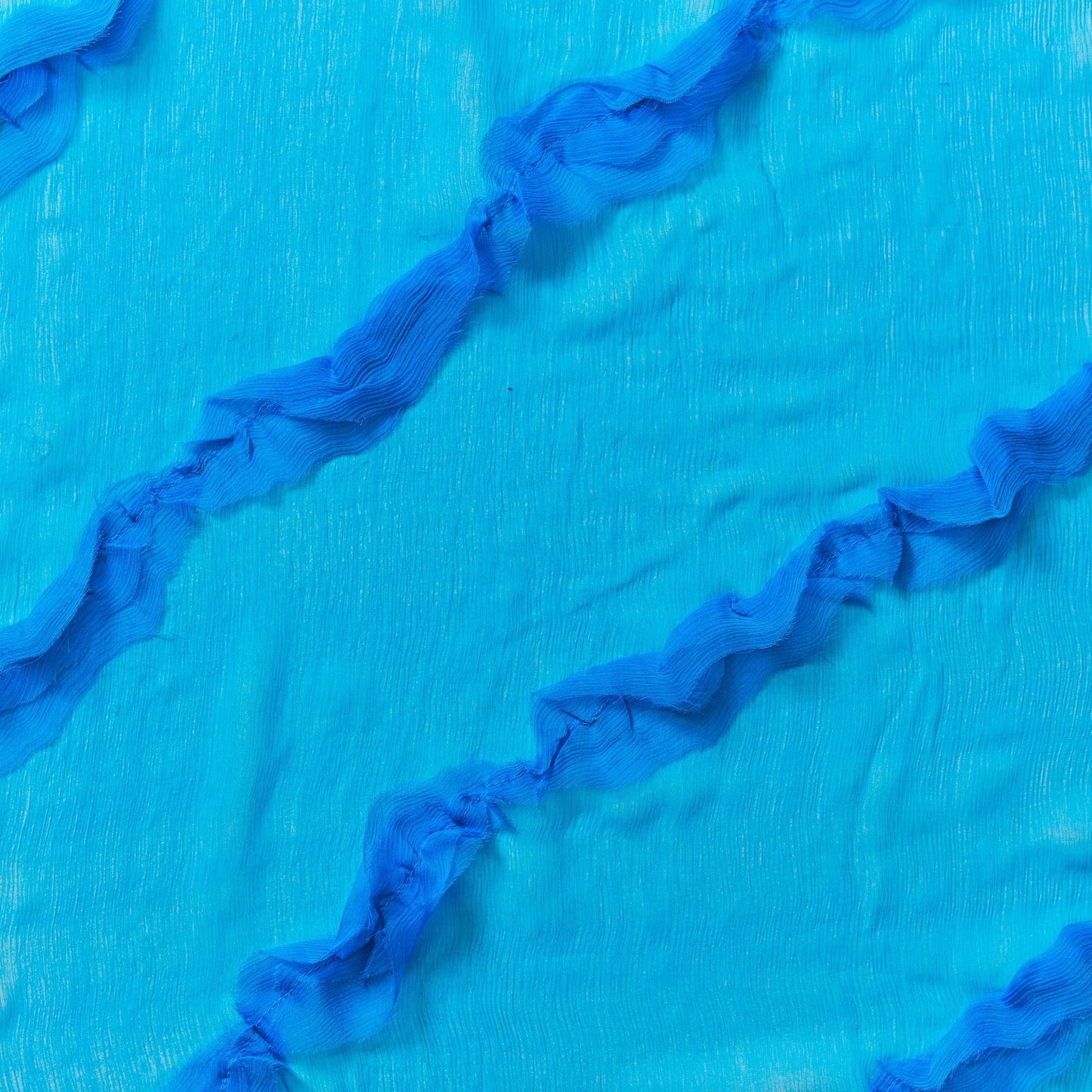 cascade showing the Lipstick color version crinkle light weight sheer pure silk chiffon with diagonal ruffle flounce