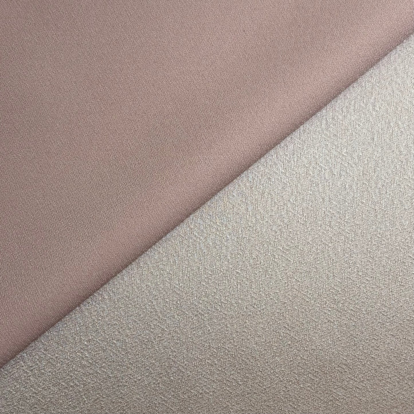 celebrity displaying the dusty colored version of a polyester microfiber featuring a double sided matte face & satin back crepe with fluid drape