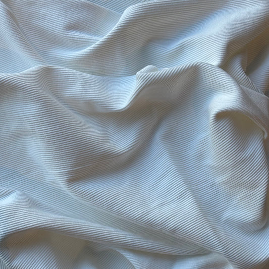 Cotton Rib displaying the Off White version of a heavyweight fine pure cotton fabric
