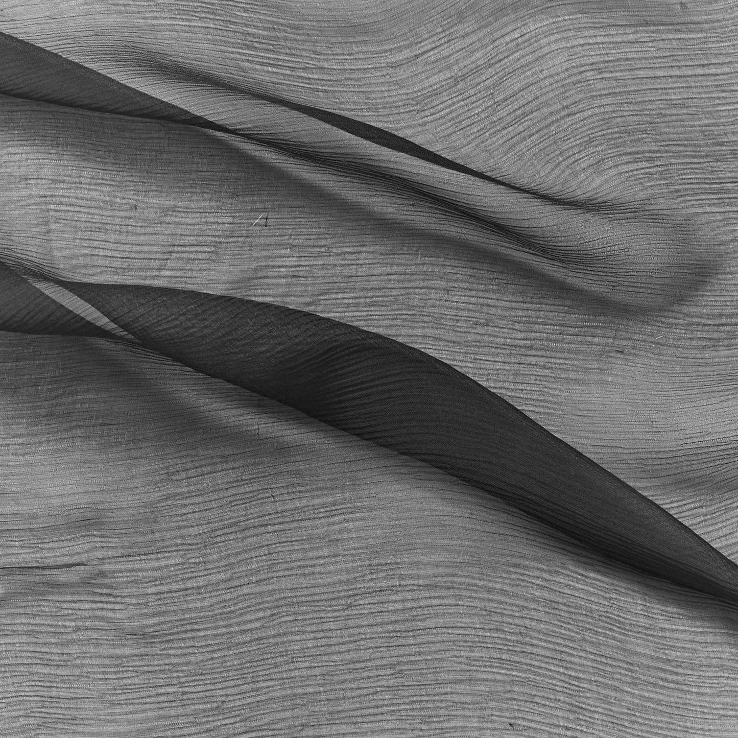 silk crinkle chiffon showing the charcoal color version of a sheer soft pure silk with textured yoryu weave and fluid drape