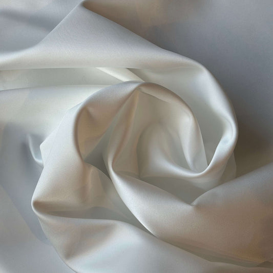 Presenting Double Satin an ivory colored double sided pure Polyester microfibre satin fabric