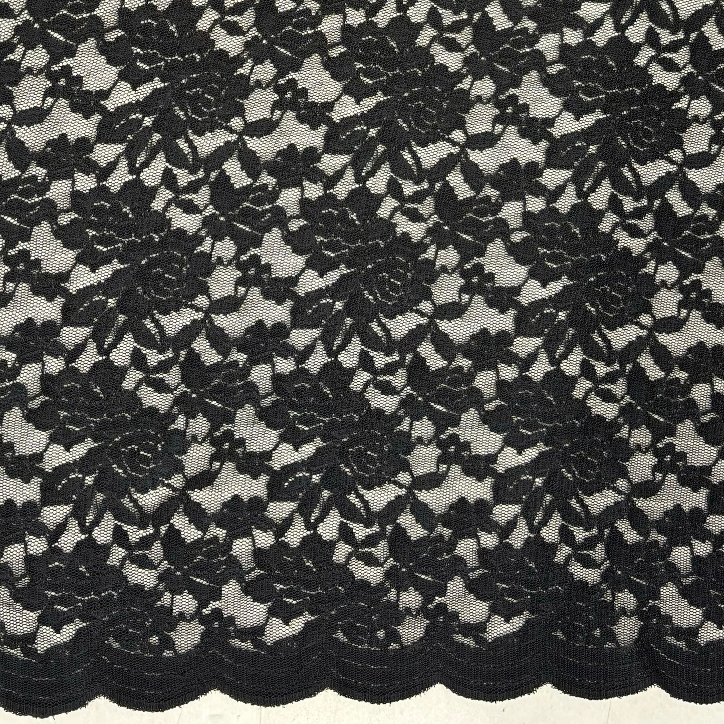 Displaying Dash Stretch Lace black cclored spandex and polyester blended floral body weight stretchable lace fabric