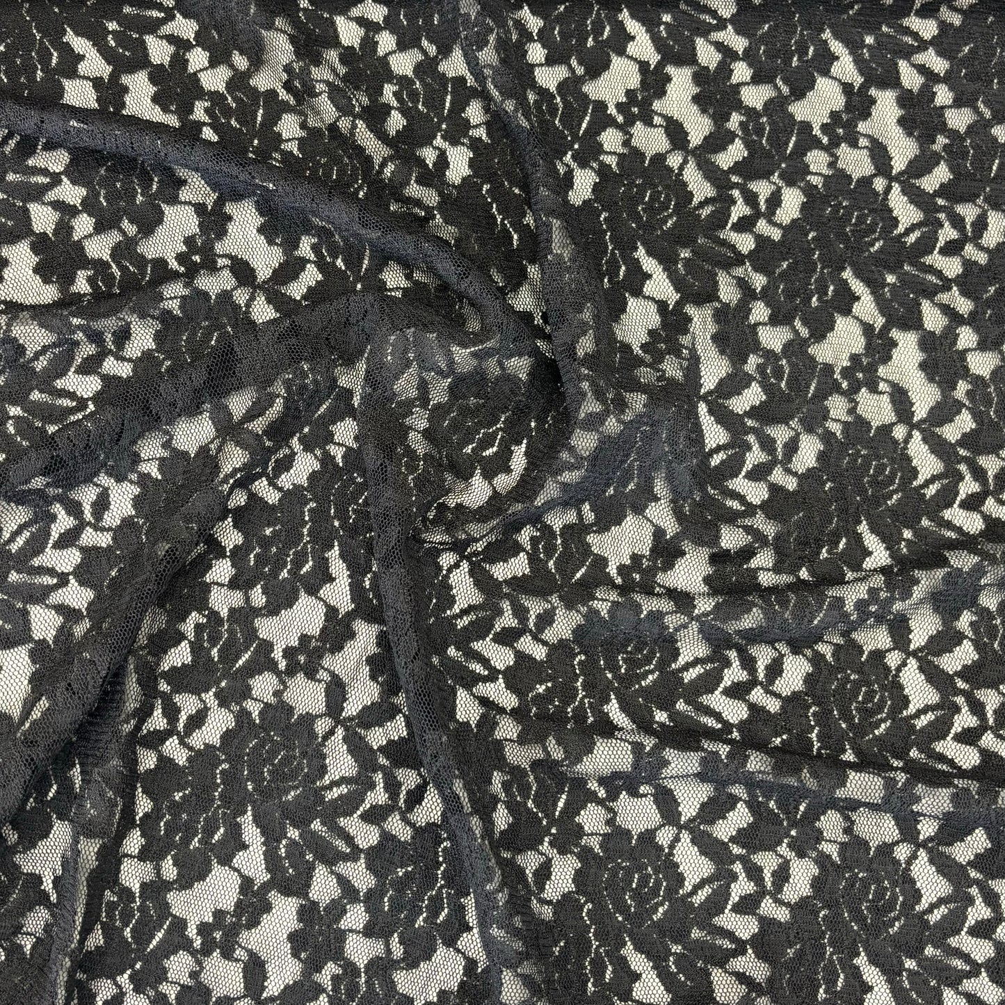 Displaying Dash Stretch Lace black cclored spandex and polyester blended floral body weight stretchable lace fabric