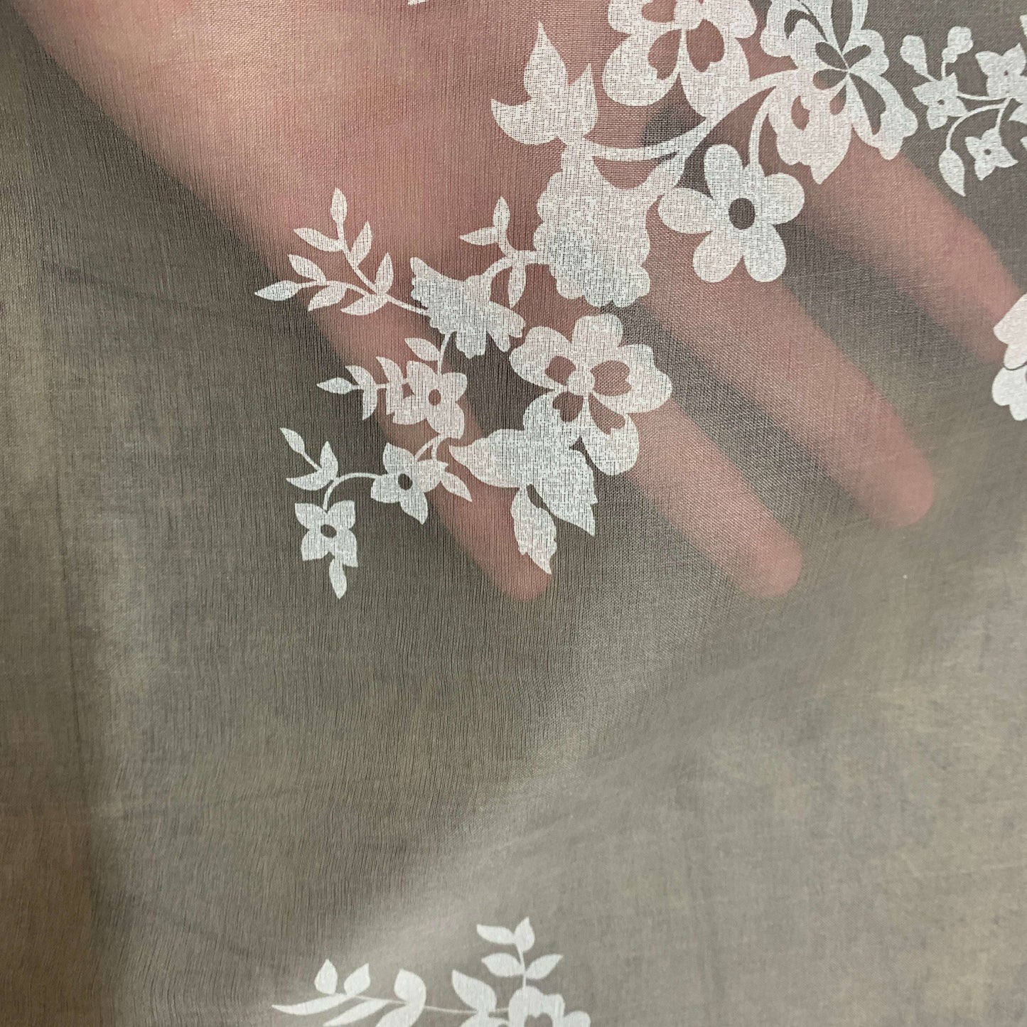 Presenting rhapsody which features a white floral print on sheer ivory pure silk organza showing the sheerness of the fabric