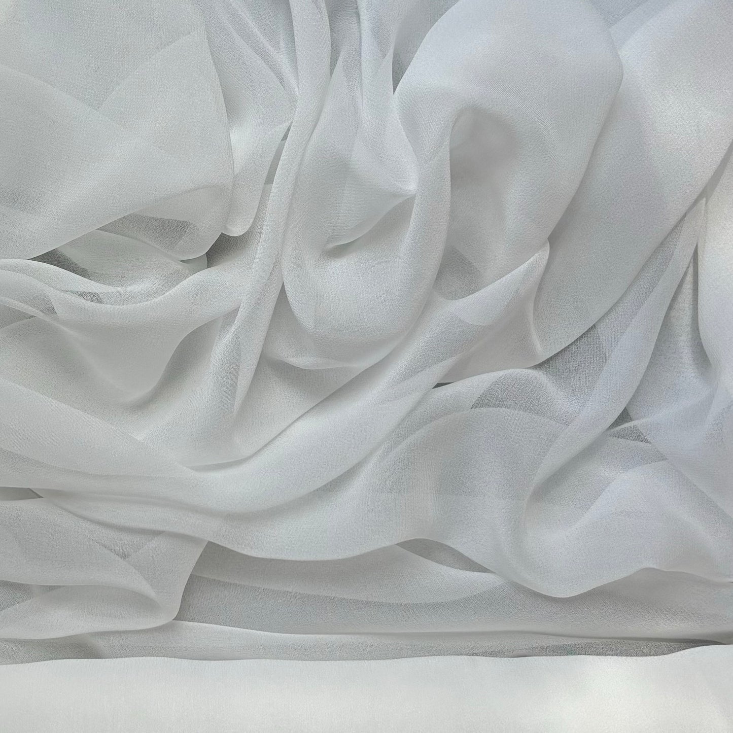 silk georgette presenting the natural color version of a Lightweight sheer floaty pure silk with excellent drape great for layering and gathering