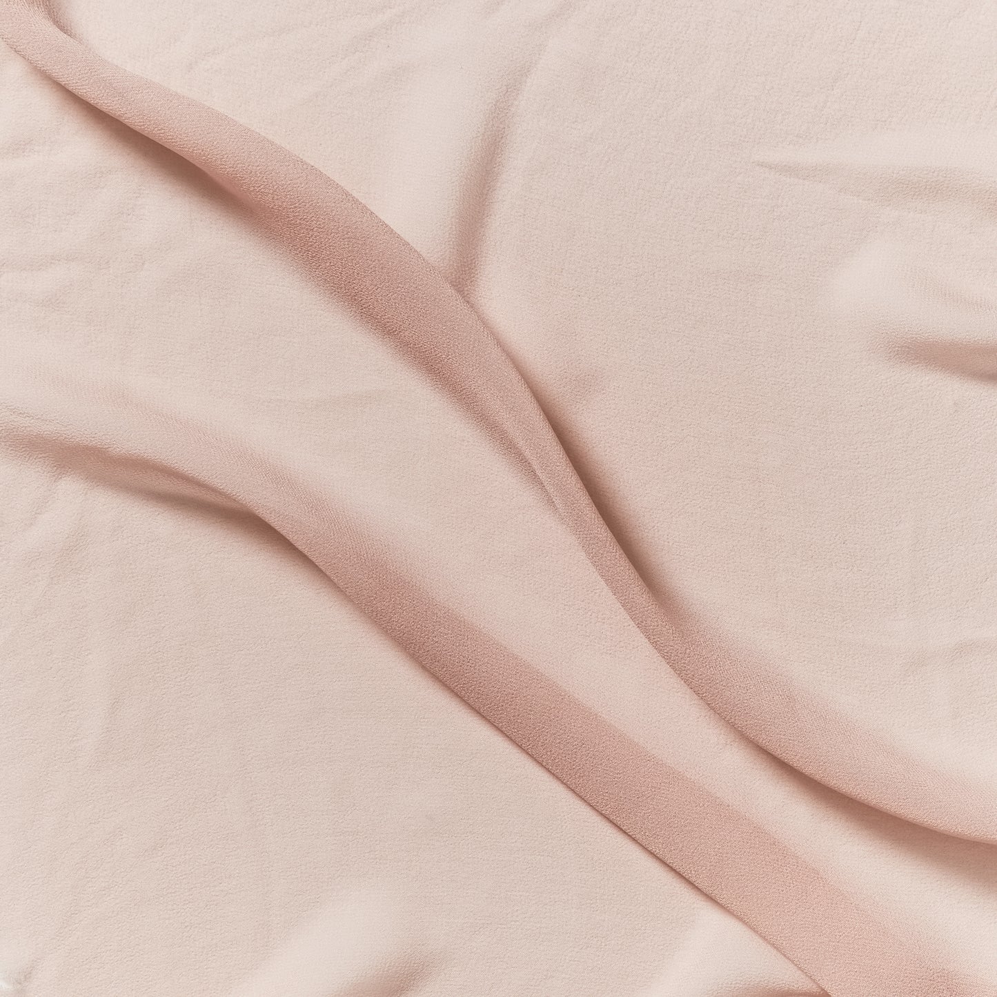 silk georgette presenting the salmon color version of a Lightweight sheer floaty pure silk with excellent drape great for layering and gathering
