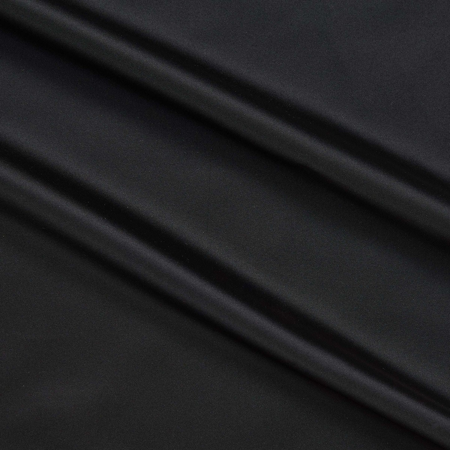 Tatler showing the plain Black color version of a pure Polyester crisp smooth and lightweight shot taffeta with lustre