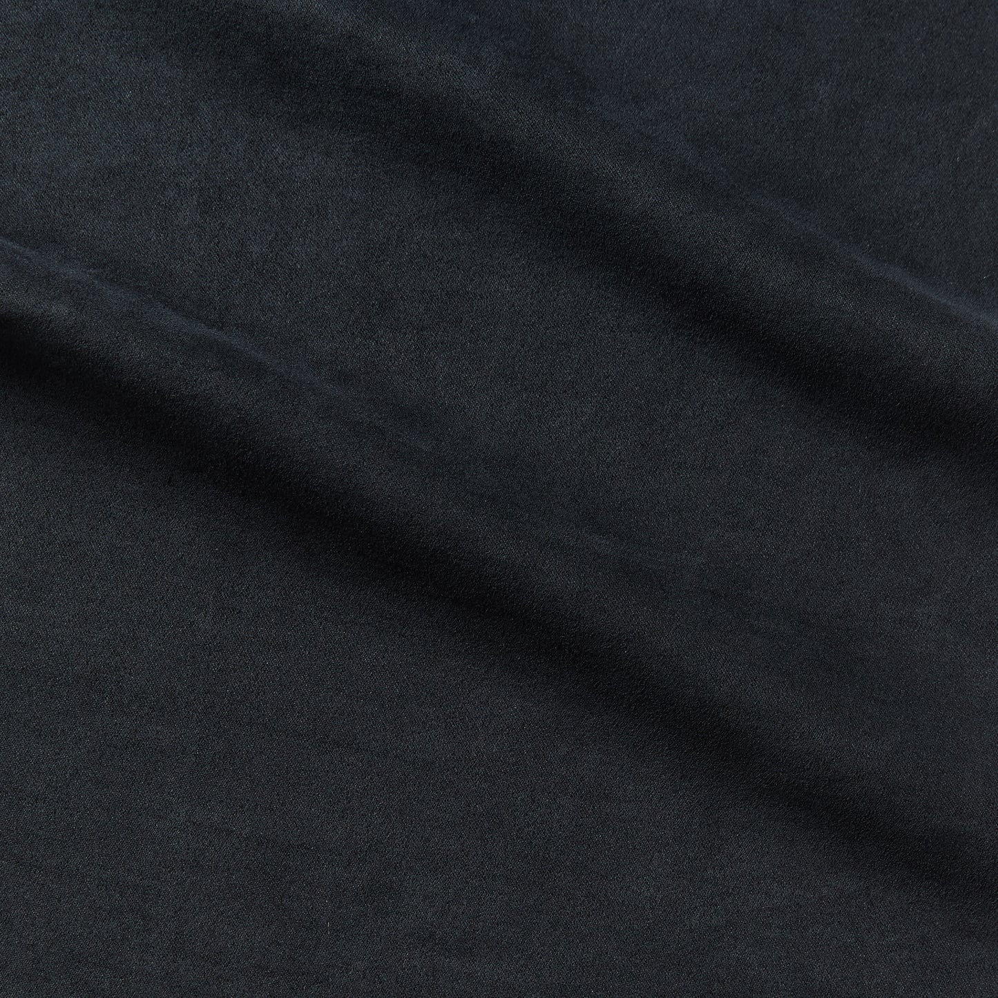 bambi displaying the blue color version which is a vegan suede like durable pure polyester moderate drape