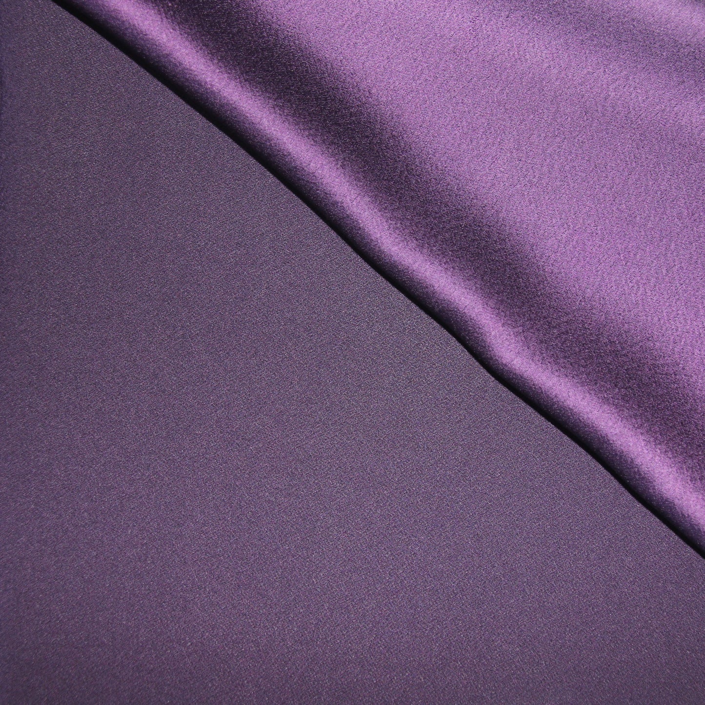 CELEBRITY displaying the purple colored version of a polyester microfiber displaying both SIDES with fluid drape