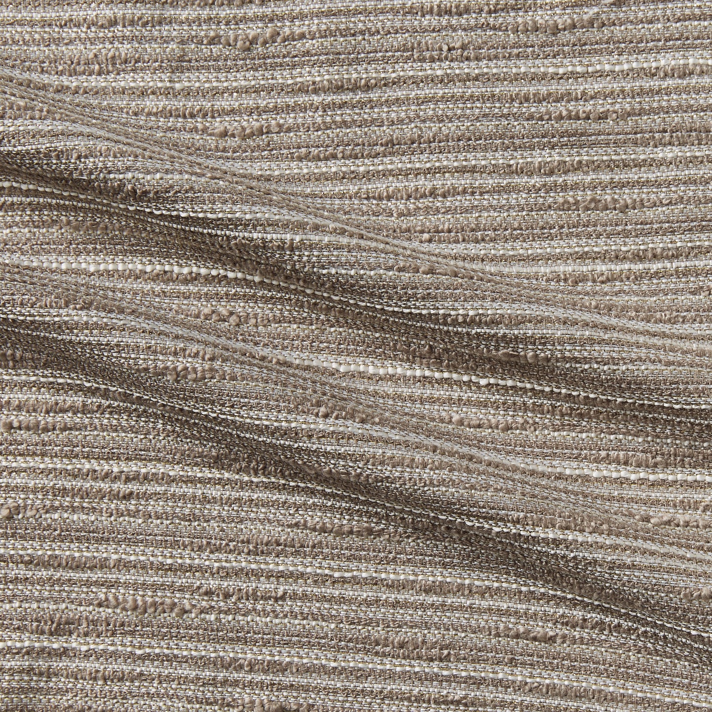 coco displaying the coffee color version of a bouclé fabric polyester cotton blend with lurex thread