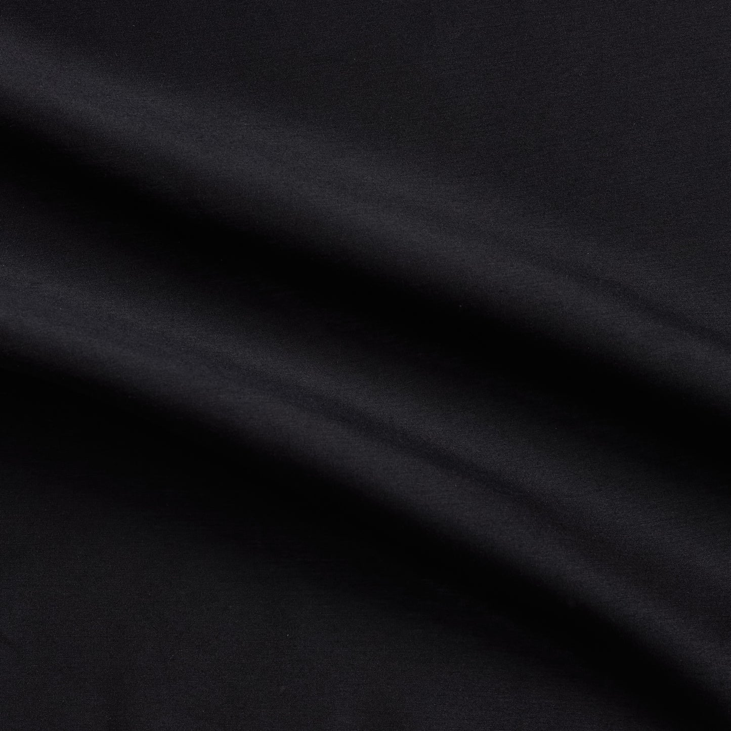 Corisia presenting the Black color version of a soft silk viscose and cotton blend with natural silk sheen medium softness and moderate drape