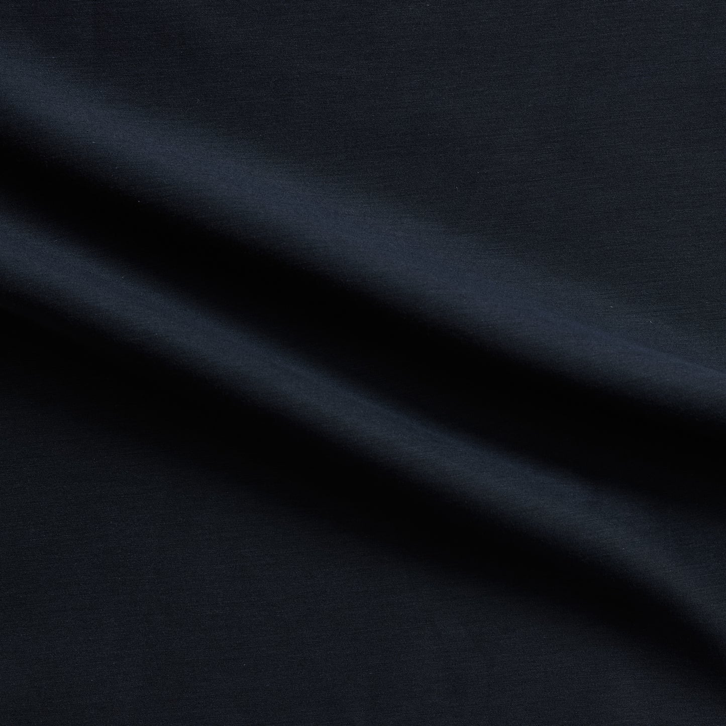 Corisia presenting the Navy color version of a soft silk viscose and cotton blend with natural silk sheen medium softness and moderate drape
