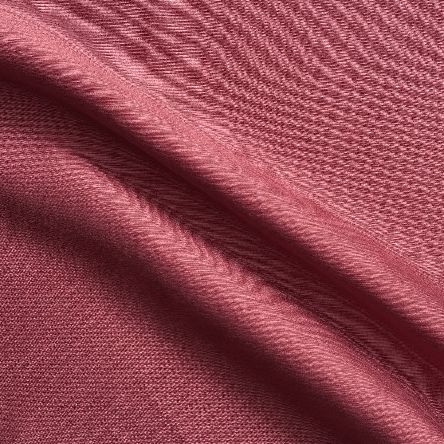 Corisia presenting the rose color version of a soft silk viscose and cotton blend with natural silk sheen medium softness and moderate drape