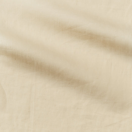 cruise presenting the biscuit color version of a lightweight linen and polyester blend with subtle sheen and moisture wicking properties