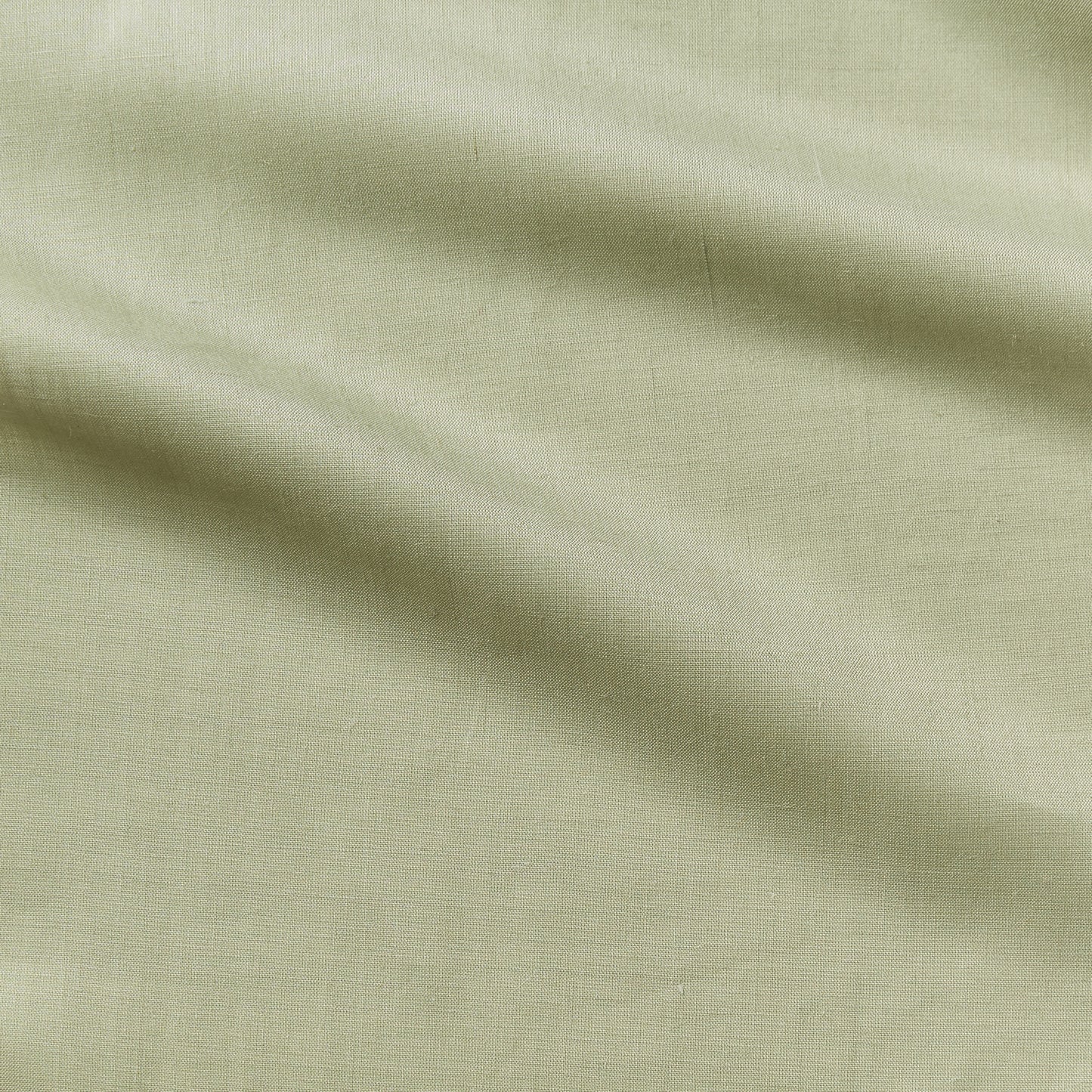 cruise presenting the fern color version of a lightweight linen and polyester blend with subtle sheen and moisture wicking properties