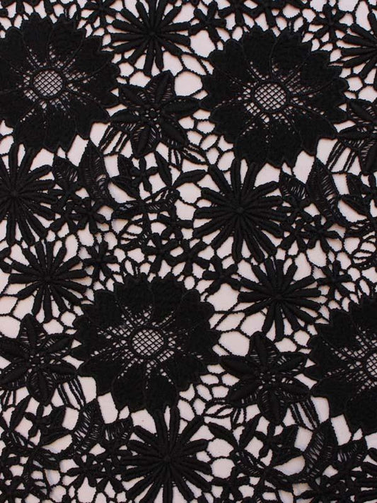 Chloe presenting the black color version with Floral daisy design on heavy weight pure polyester Guipure lace with double scalloped edge