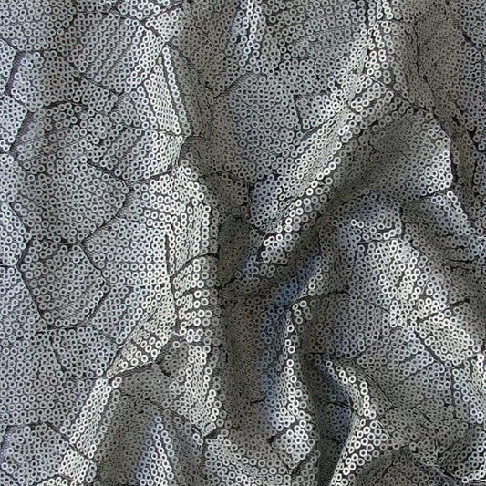 Presenting Clash which features silver colored Sequins in a abstract design on Black pure Polyester Mesh