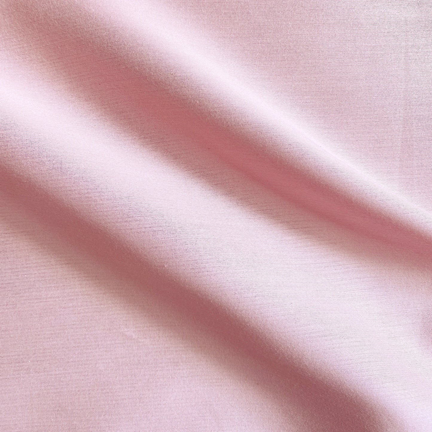Corisia presenting the Pale Pink color version of a soft silk viscose and cotton blend with natural silk sheen medium softness and moderate drape