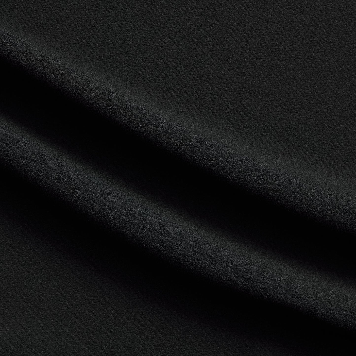dublin displaying the black color version of a stretch heavy weight textured crepe polyester with spandex for two-way stretch