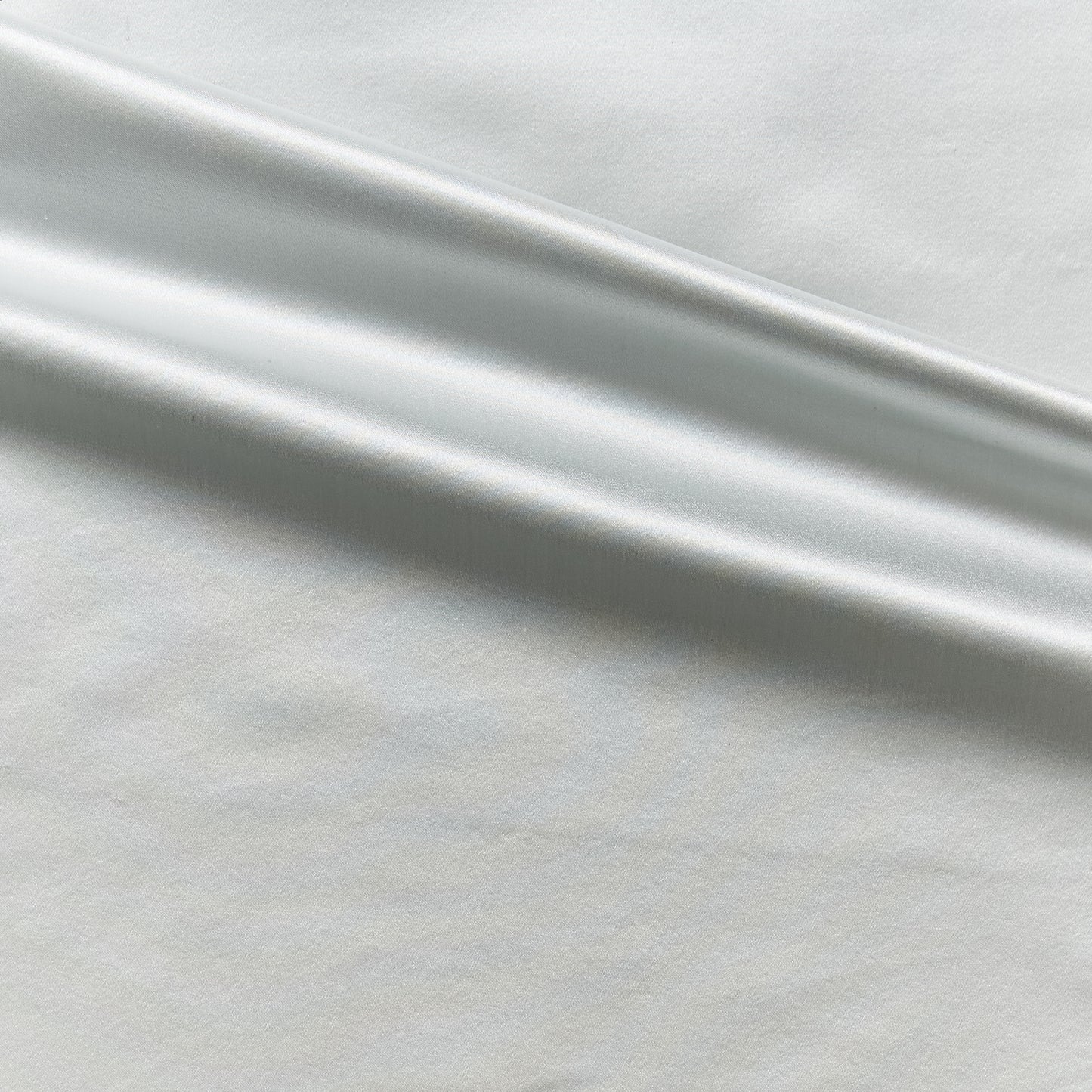 Duchess presenting the pale blue color version on heavy weight mulberry silk satin with moderate drape