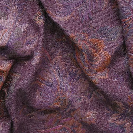 Presenting Donna a fabric with purple colored shades floral leafy brocade on heavy weight polyester and rayon with lurex folded