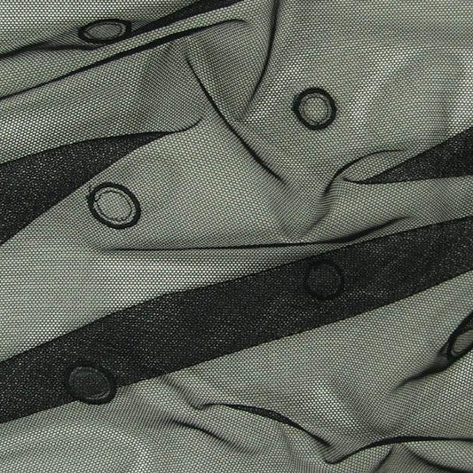 Evolve presenting black Embroidered circles and spots on black Mesh