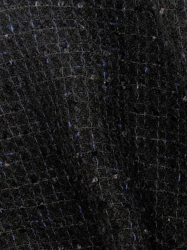 Eyelash presenting the black color woven yarn dyed tweed-like Acrylic blend for suiting in close up