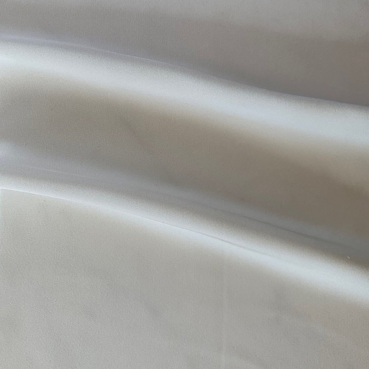 silk faille presenting the natural color version of a heavy weight pure silk crepe de chine with soft matt sheen and fluid drape