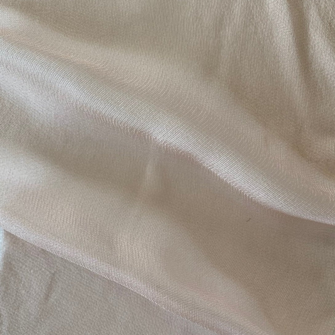 Ghost Mesh displaying the dusty color version of a fine and delicate pure silk mesh with subtle silk sheen
