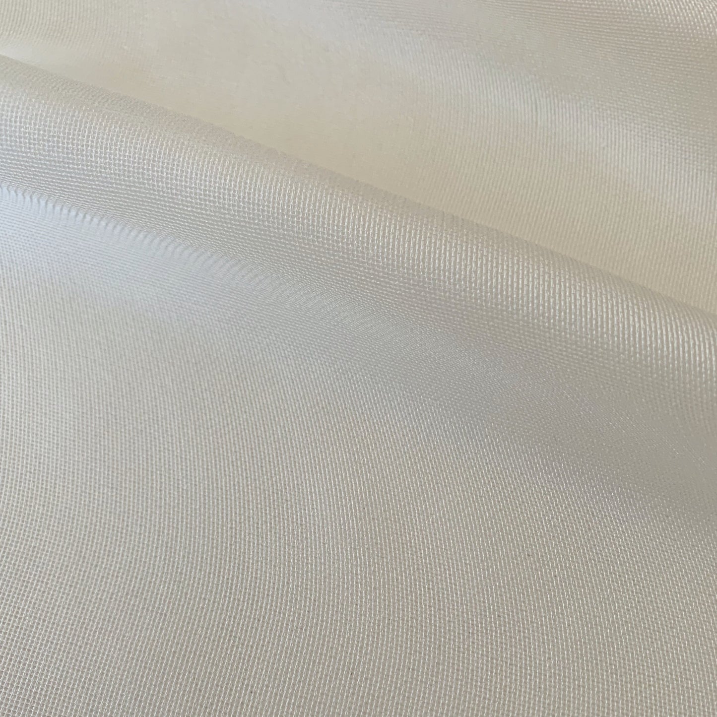 Ghost Mesh displaying the natural color version of a fine and delicate pure silk mesh with subtle silk sheen closeup
