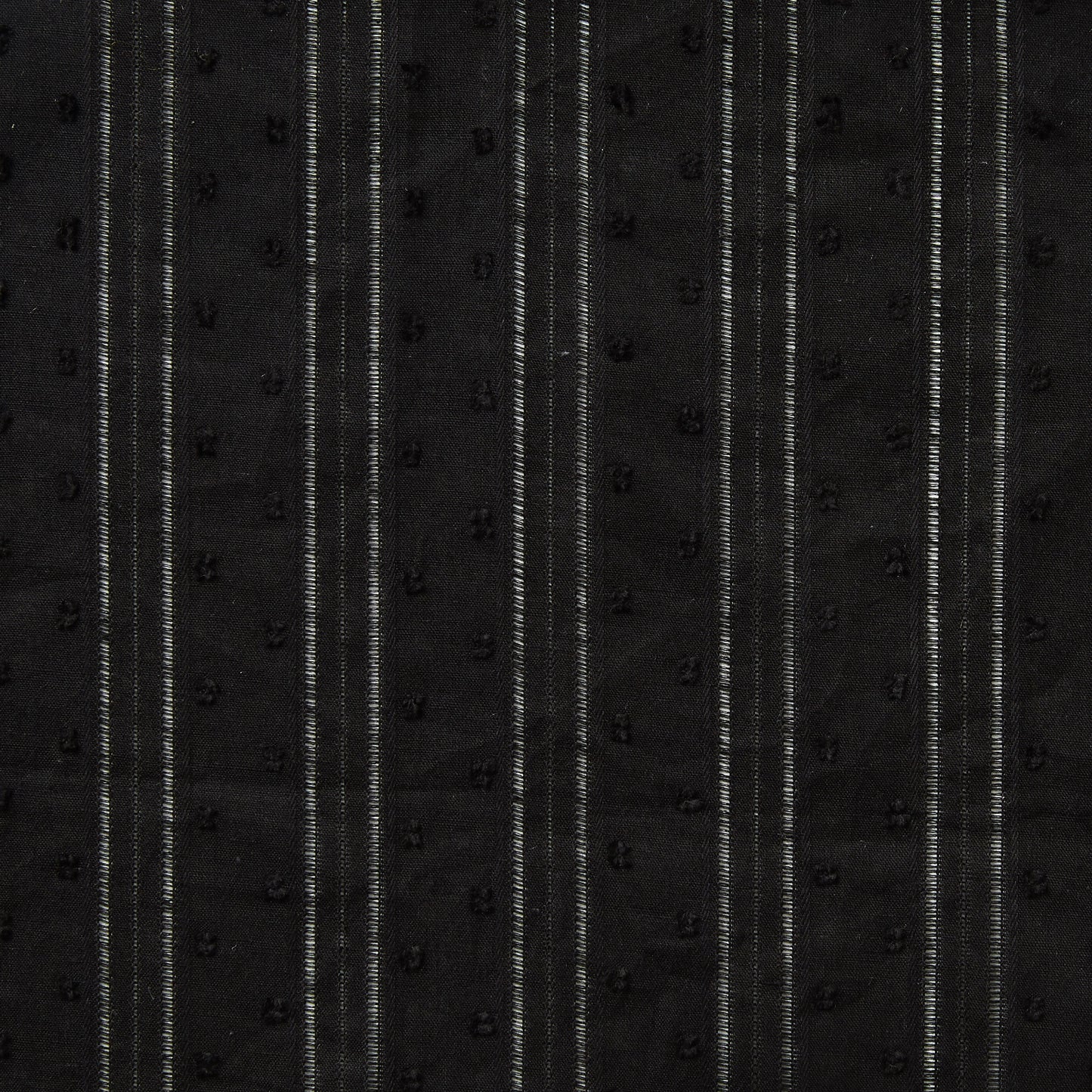Exhibiting Hailspot a Black colored base of a breathable soft cotton voile with elegant drop stitch stripes and tuft spot textured face