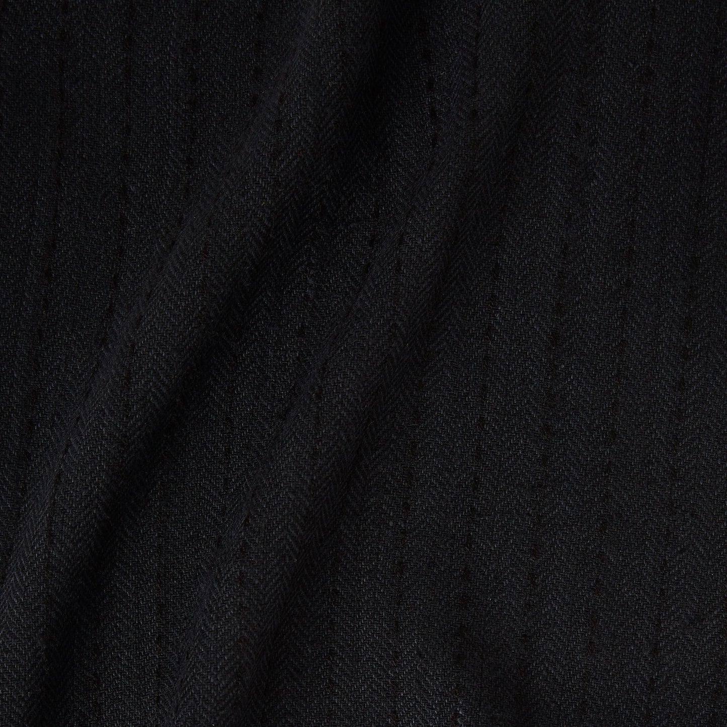 Featuring herringbone a black colored classic patterned all natural viscose and wool blend folds