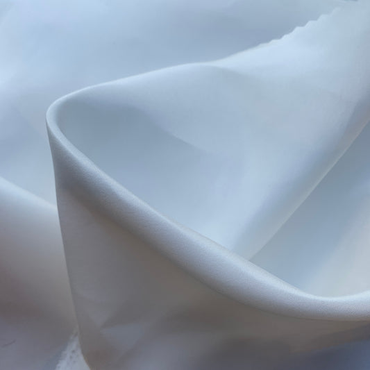 silk taffeta presenting the natural color version of a smooth crisp pure silk with good drape with good drape