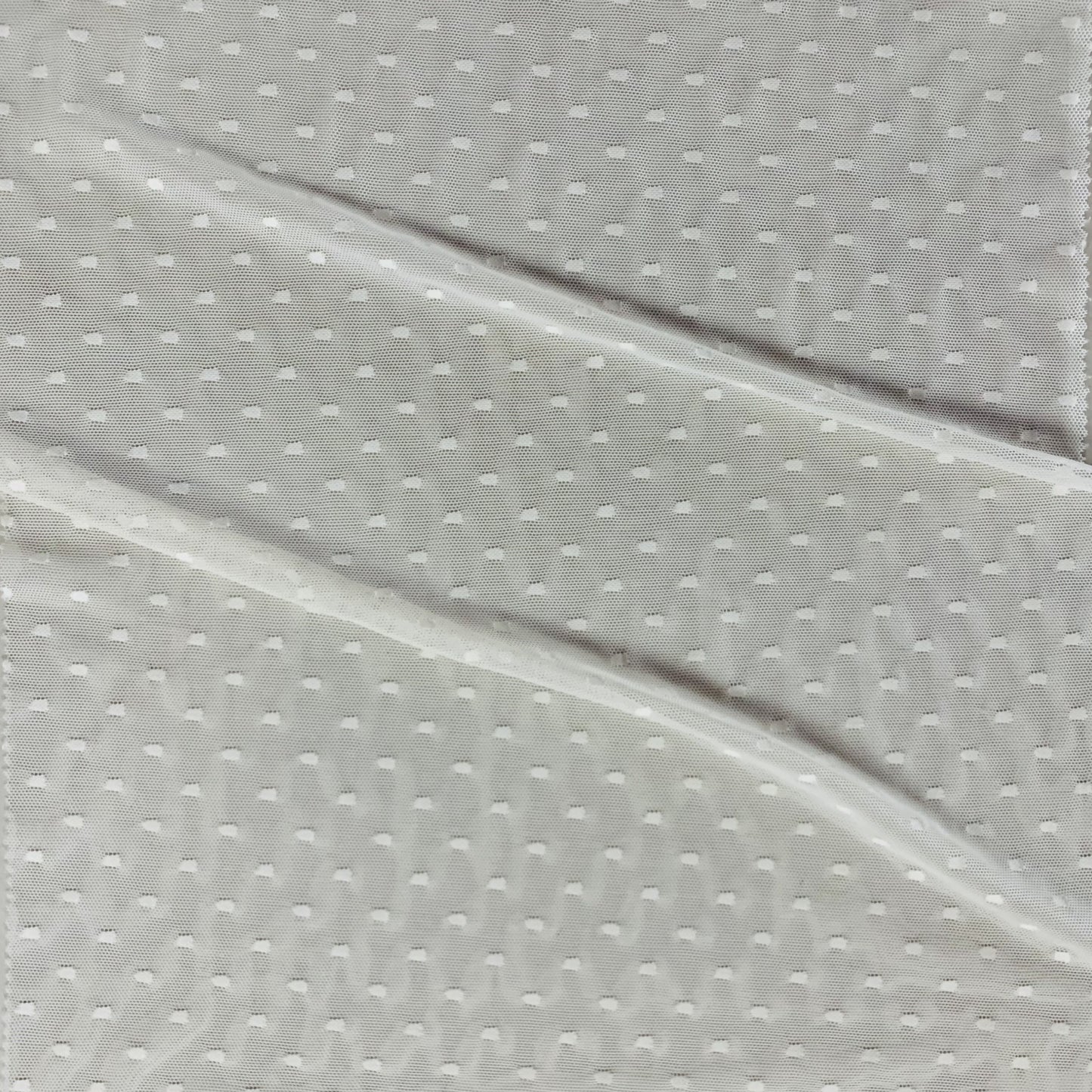 Exhibiting Focus an ivory colored Nylon Sheer Stretch Net featuring dobby spot design blended with spandex featuring good drapes