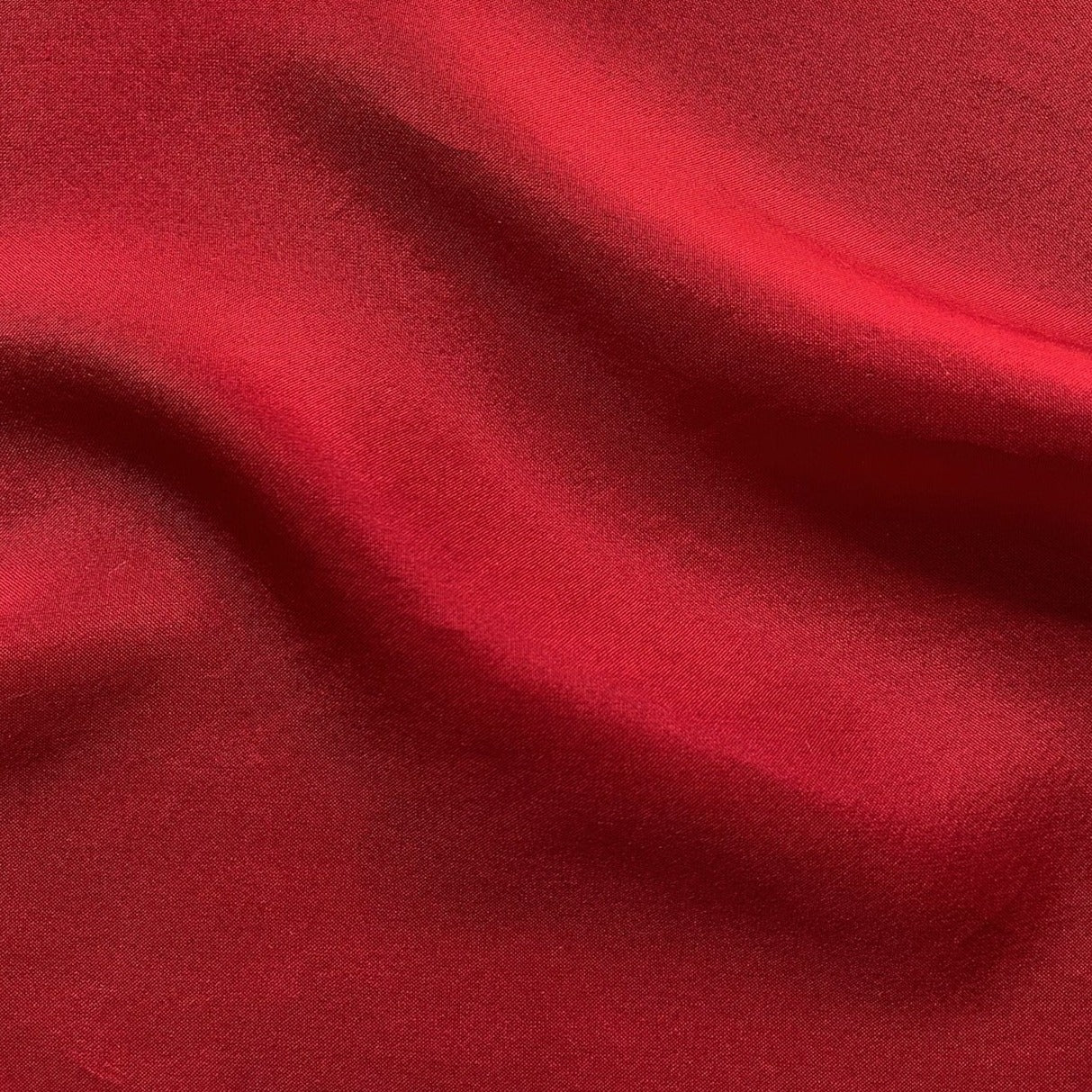 jap silk presenting the Red color version of a soft light weight mulberry pure silk with fluid drape and natural sheen