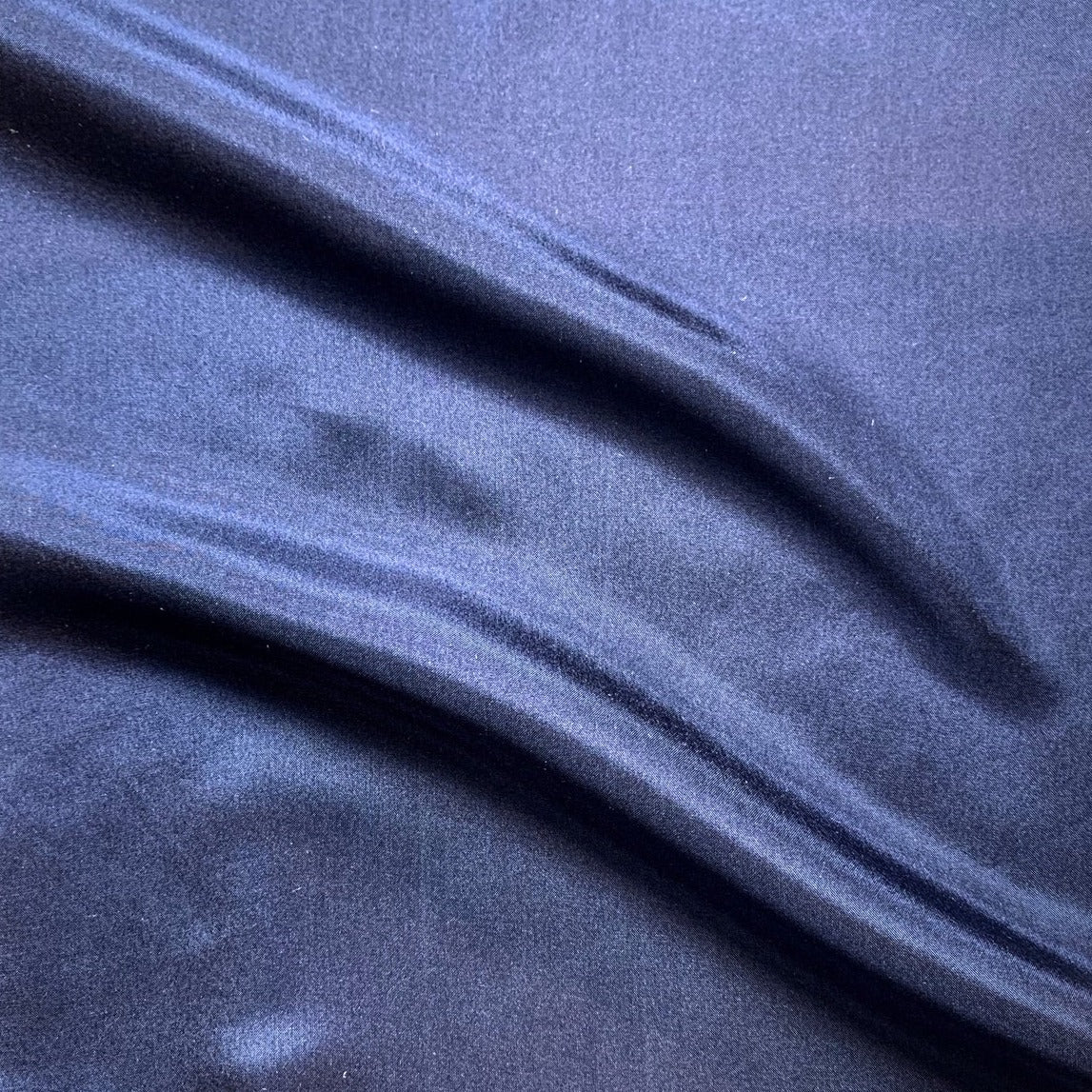 jap silk presenting the Navy color version of a soft light weight mulberry pure silk with fluid drape and natural sheen