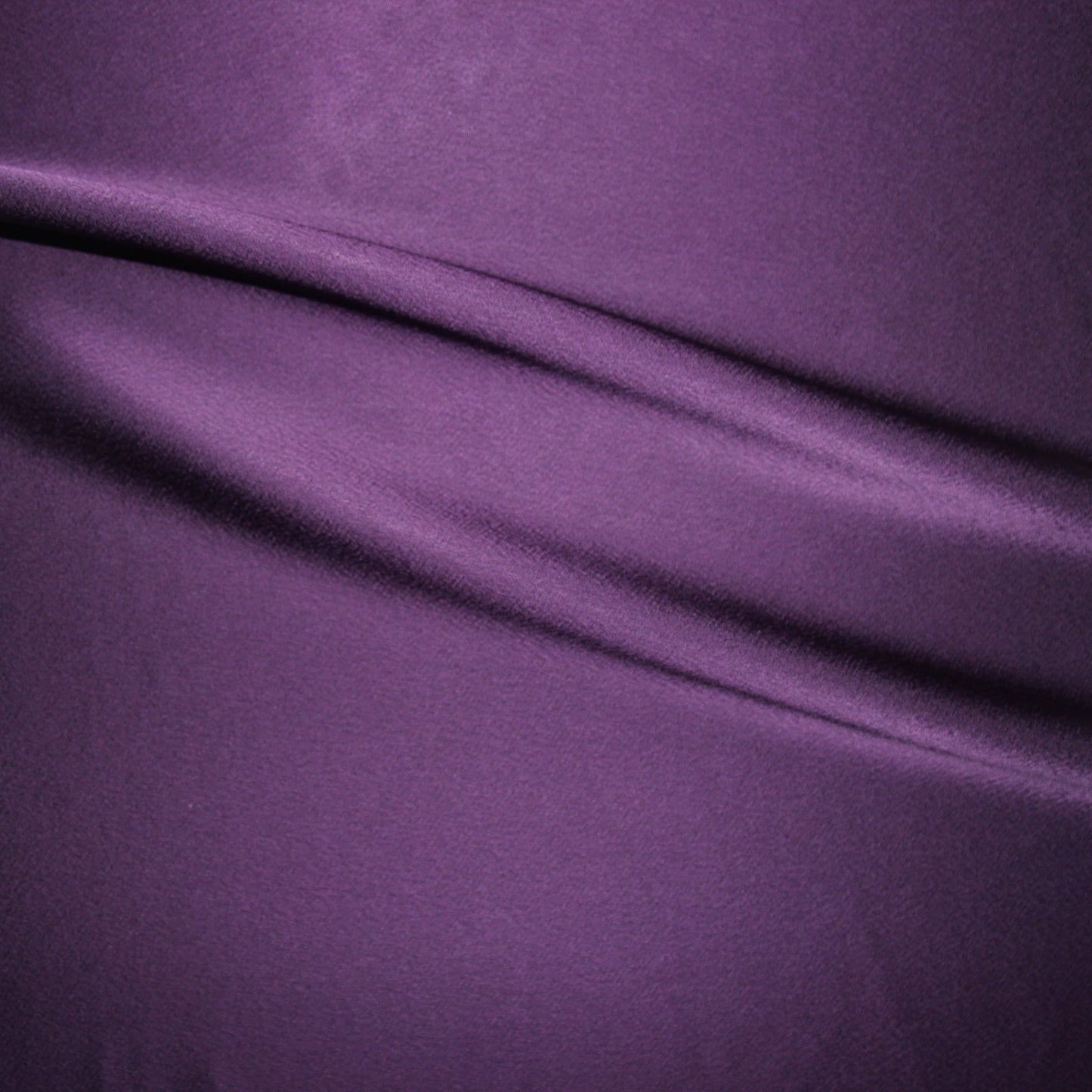 celebrity presenting the teal colored version of a polyester microfiber double sided matte face & satin back crepe with fluid drape