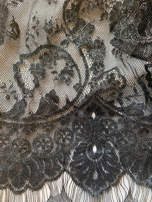 Showing tivoli which features a metallic black EYELASH on a nylon, rayon and cotton blend with metallic print