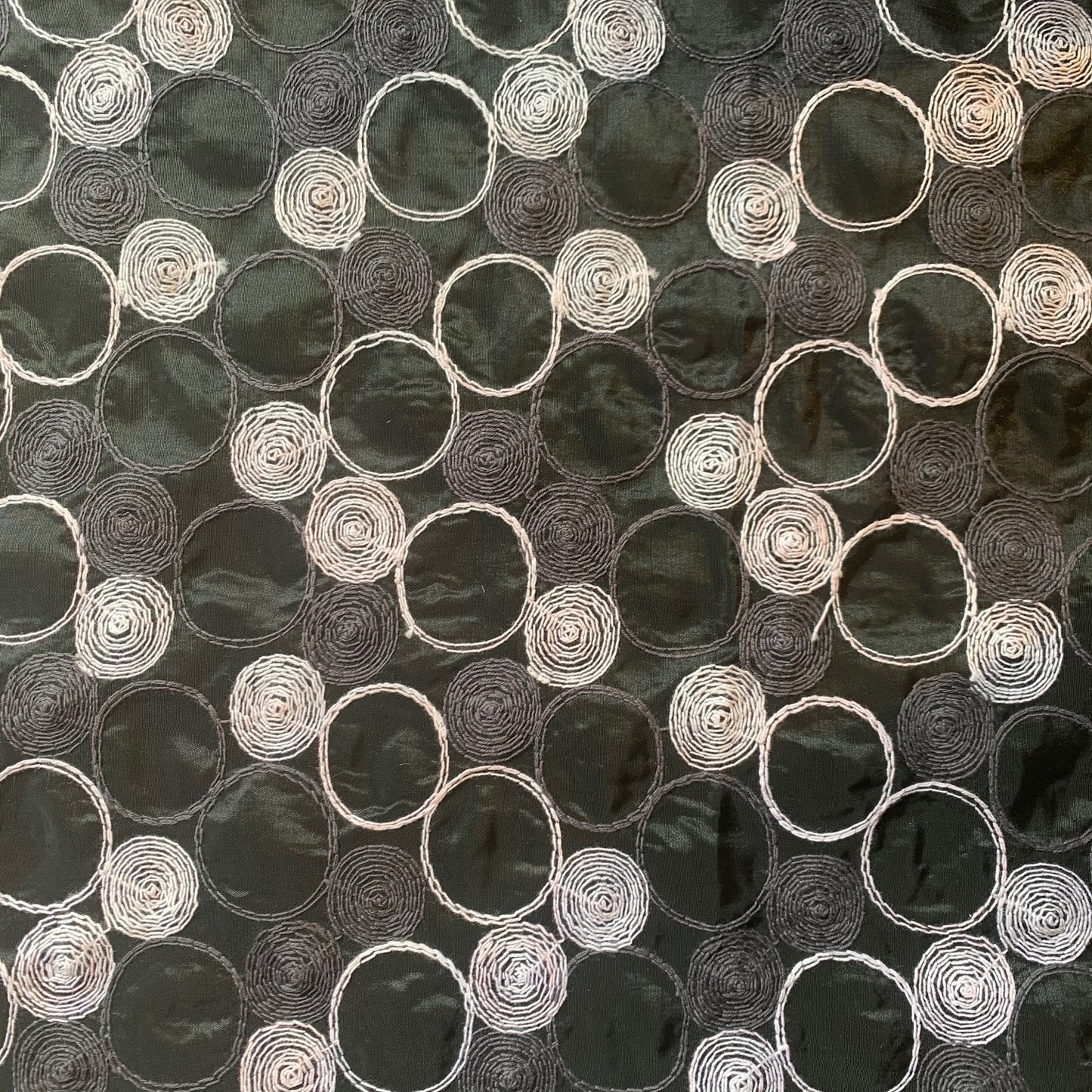 Presenting shabby featuring black colored geometric Circle embroidery on polyester and nylon taffeta with cool and crisp hand feel