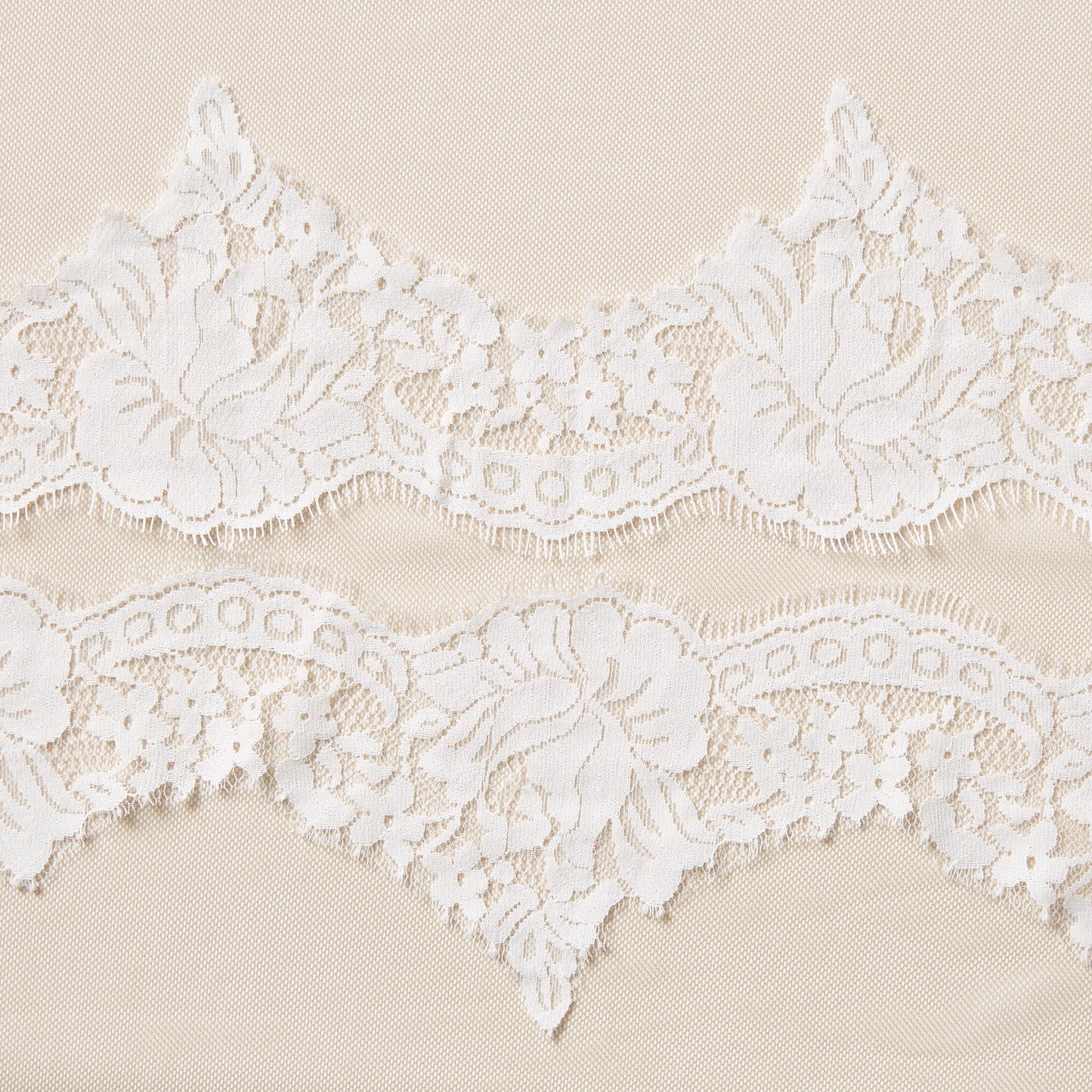 Exhibiting rose lace with the the trim Scalloped lace with eyelash trim on ivory colored pure nylon
