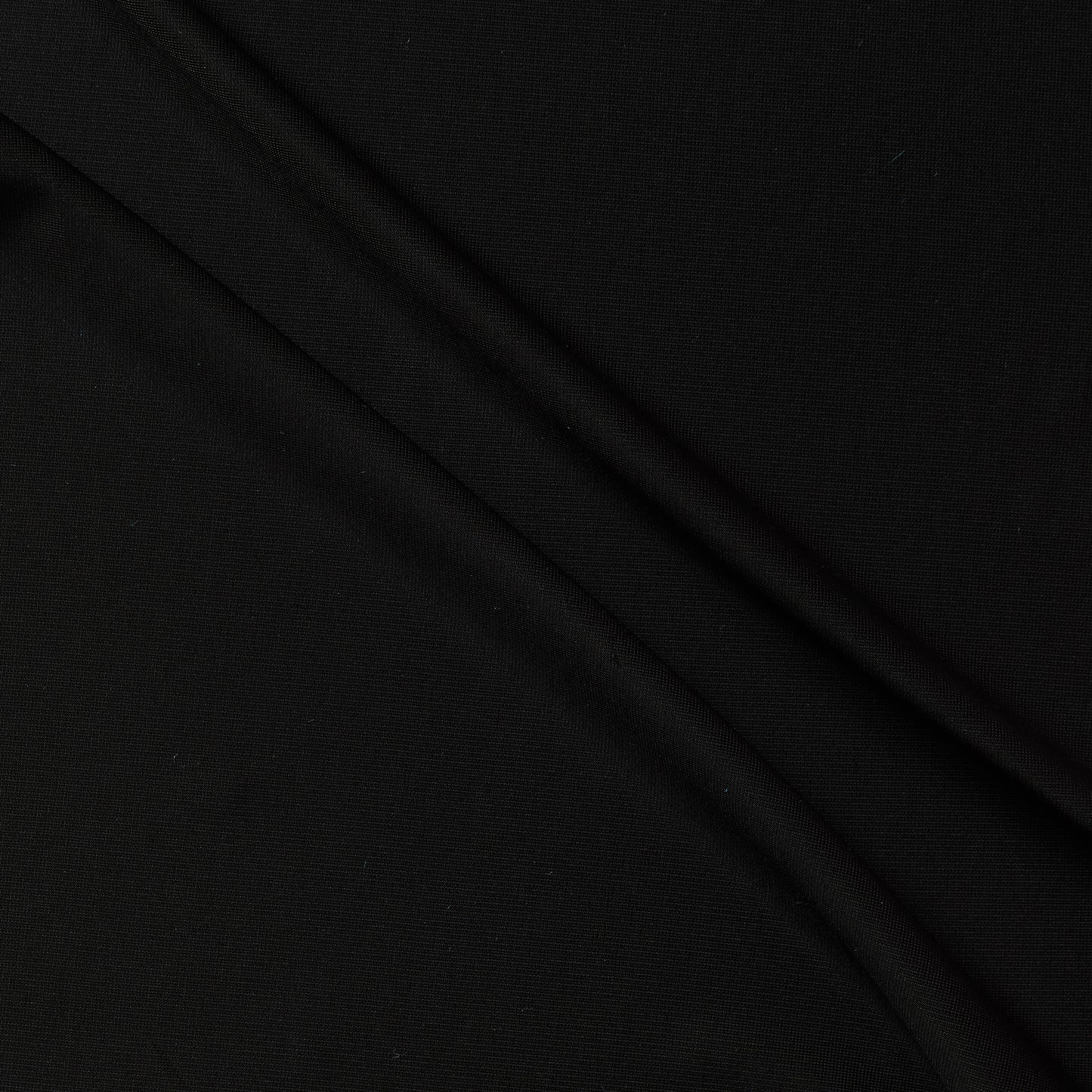 Exhibiting Jasper a black colored Stretch knit rayon with spandex featuring a gloss sateen face and featuring fluid drape