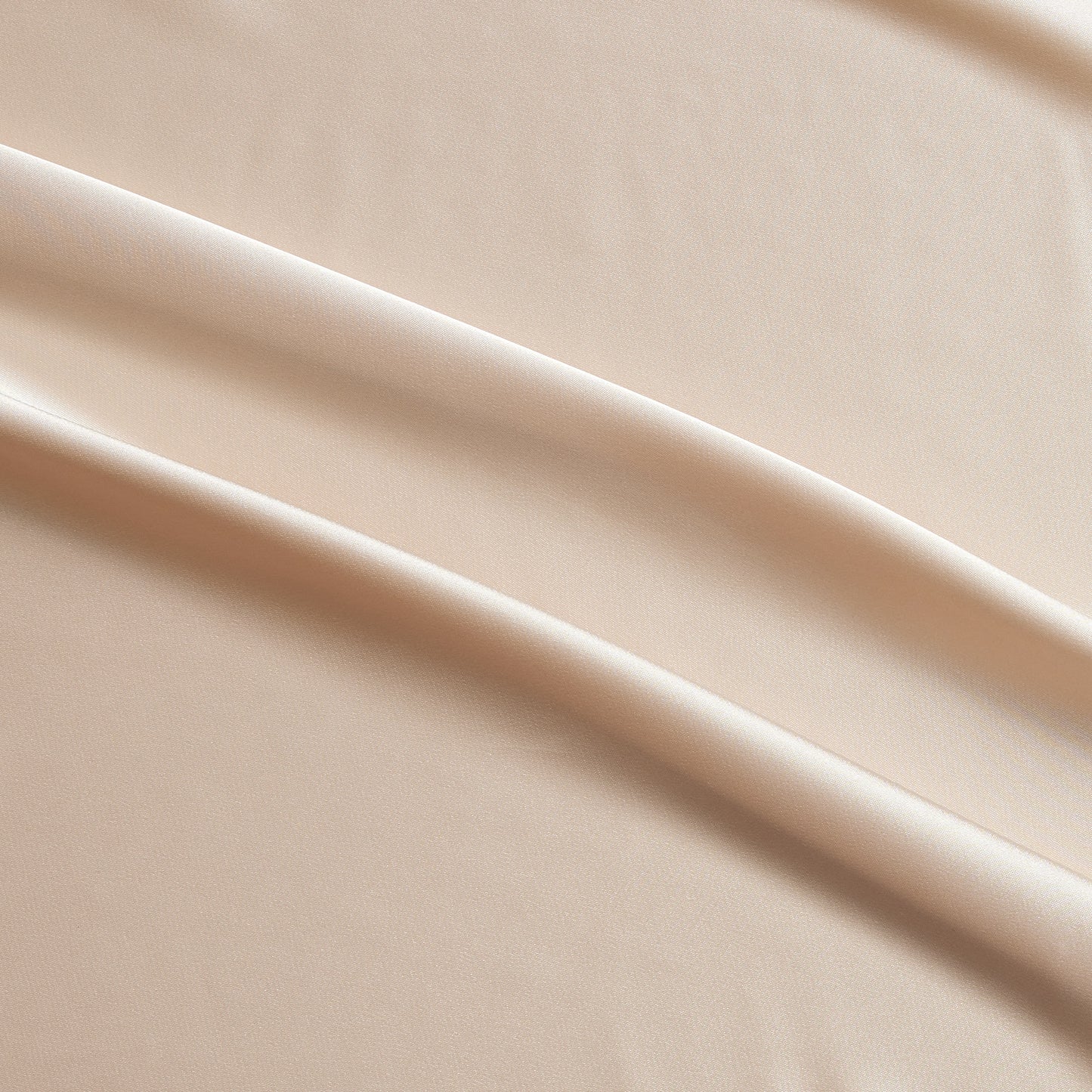 lola presenting the champagne color version of a stretch light weight soft satin polyester with spandex