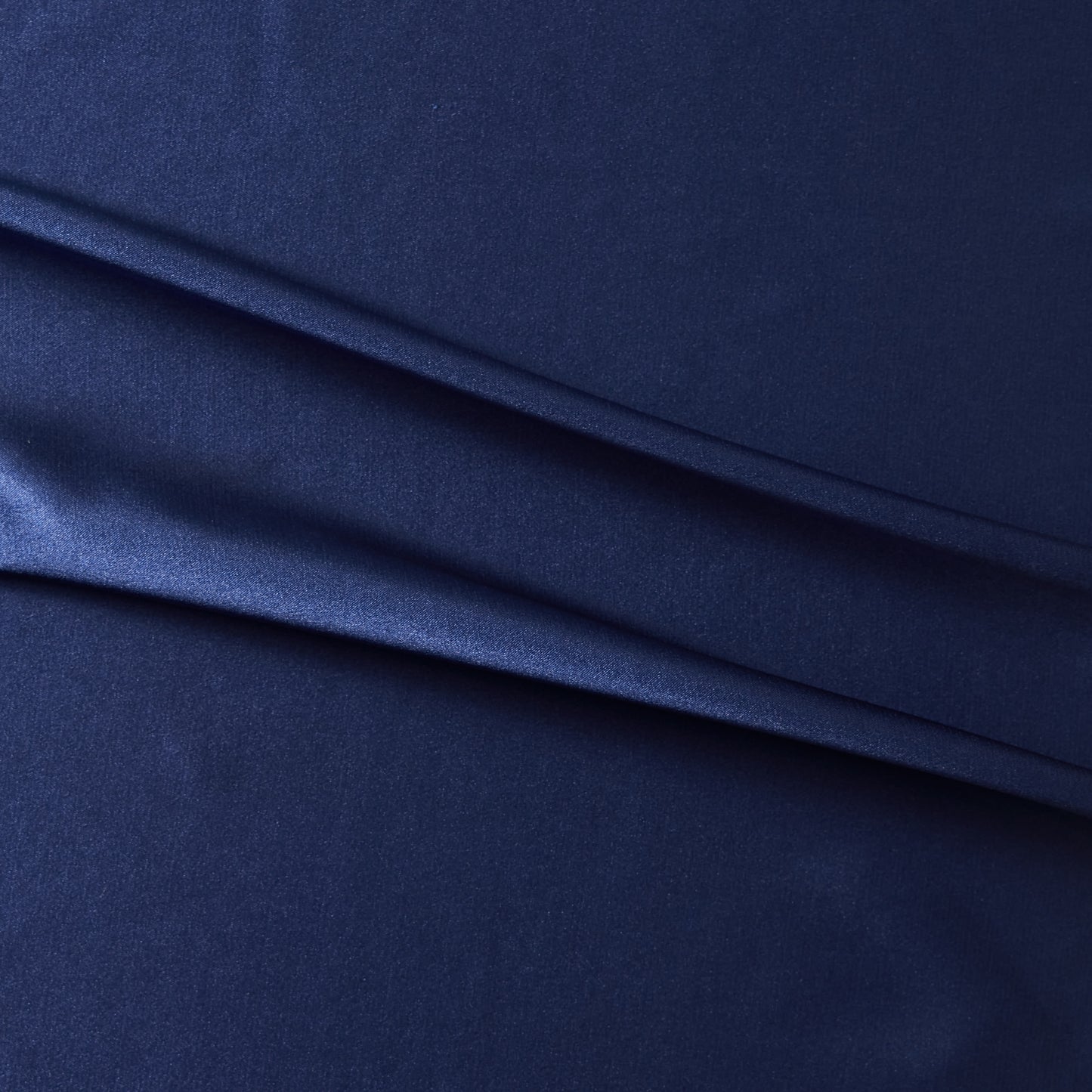 lola presenting the ink color version of a stretch light weight soft satin polyester with spandex