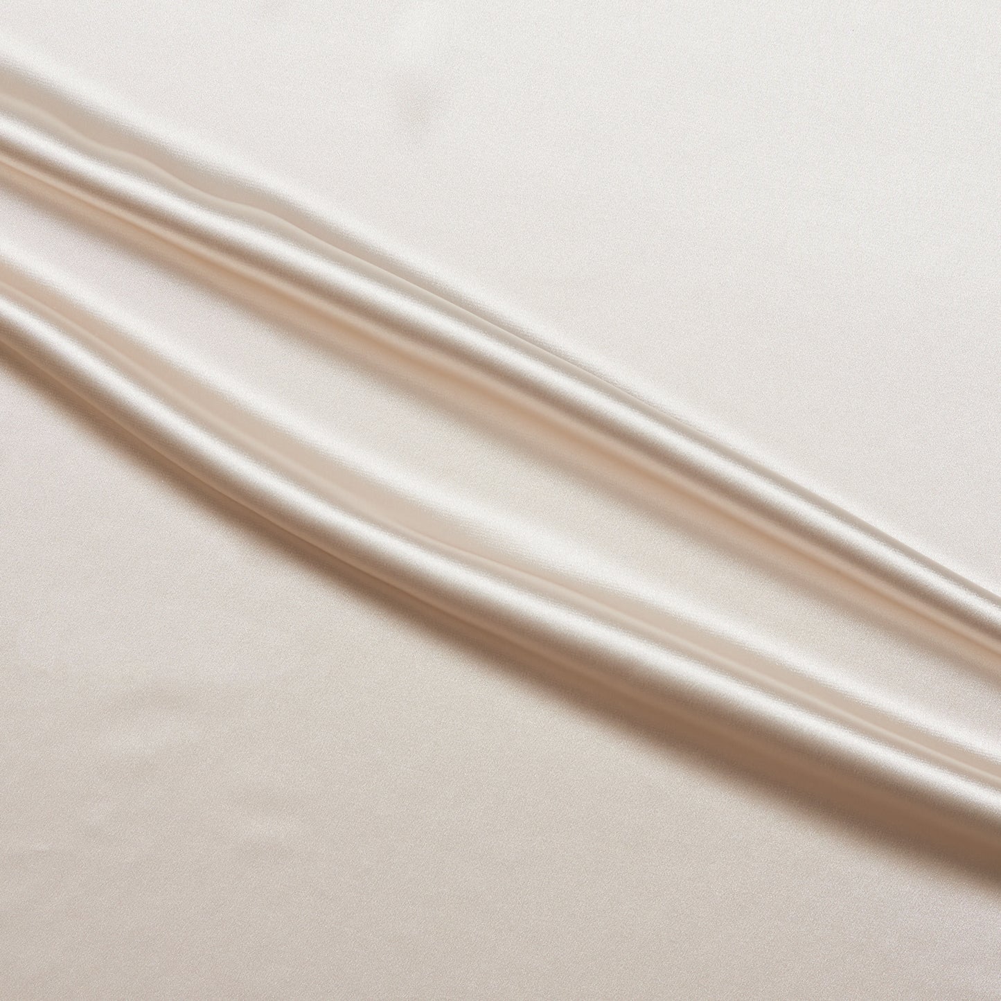lola presenting the latte color version of a stretch light weight soft satin polyester with spandex