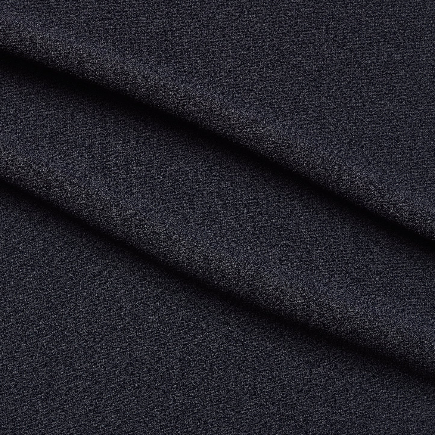 London Crepe presenting the charcoal color version with 2 way stretch knit polyester with spandex
