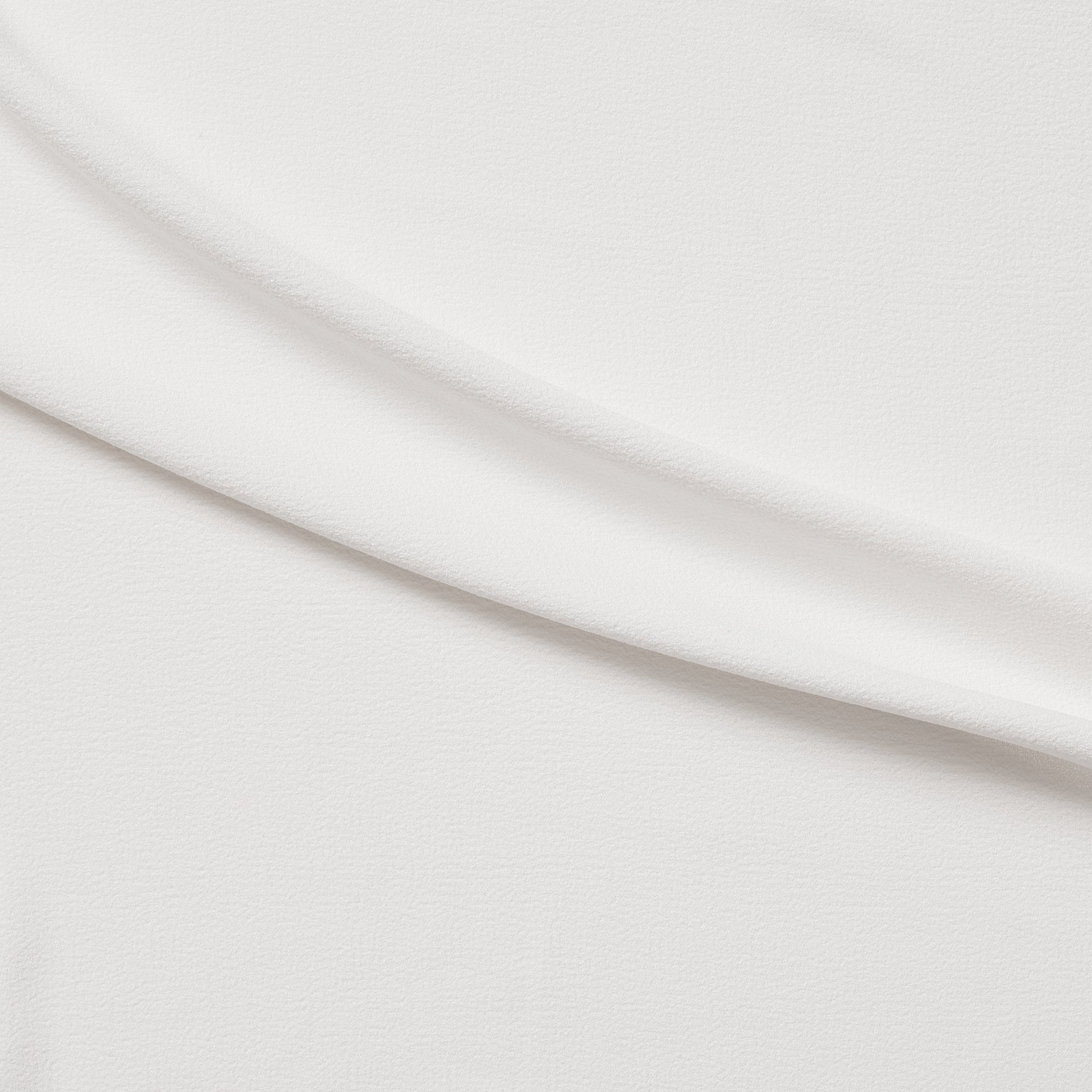 London Crepe presenting the ivory color version with 2 way stretch knit polyester with spandex