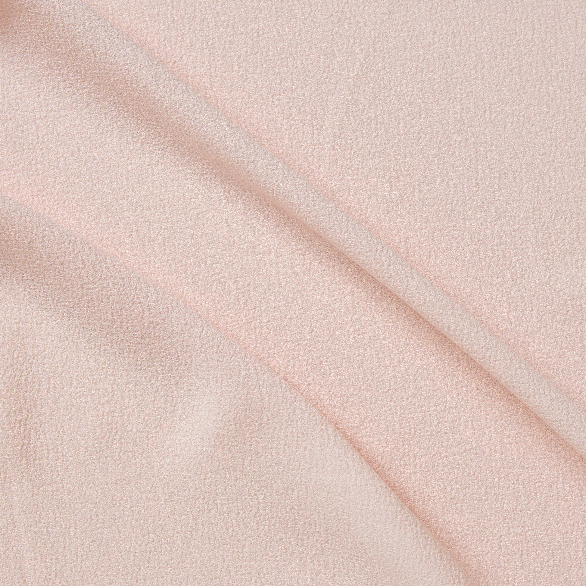 London Crepe presenting the pink color version with 2 way stretch knit polyester with spandex