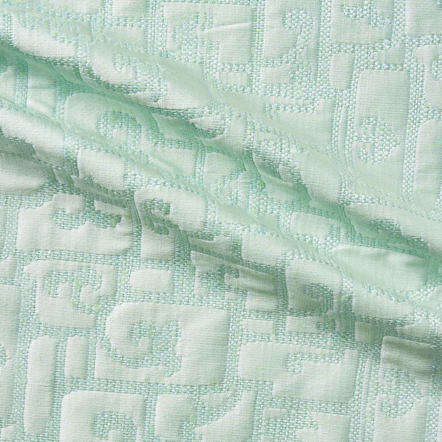 luxor displaying the mint color version of a heavy weight pure silk brocade with abstract Egyptian styled pattern